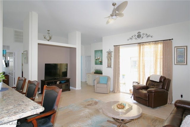 living room with ceiling fan and light tile patterned floors