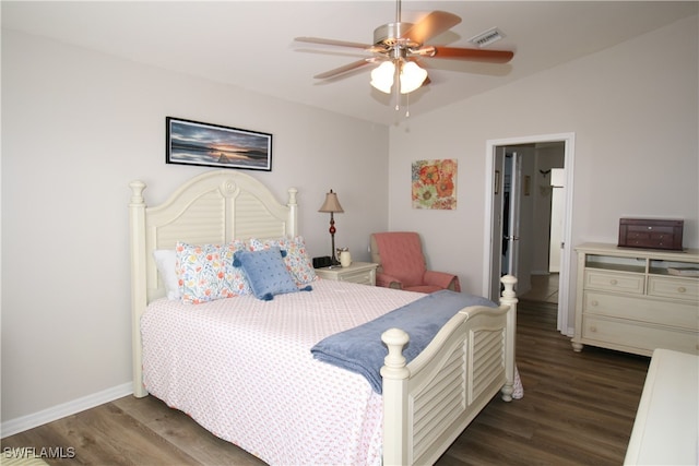 bedroom with vaulted ceiling, dark hardwood / wood-style floors, and ceiling fan