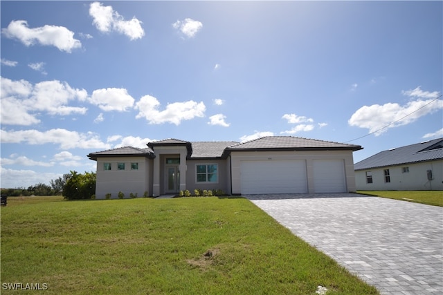 view of front facade with a front lawn and a garage