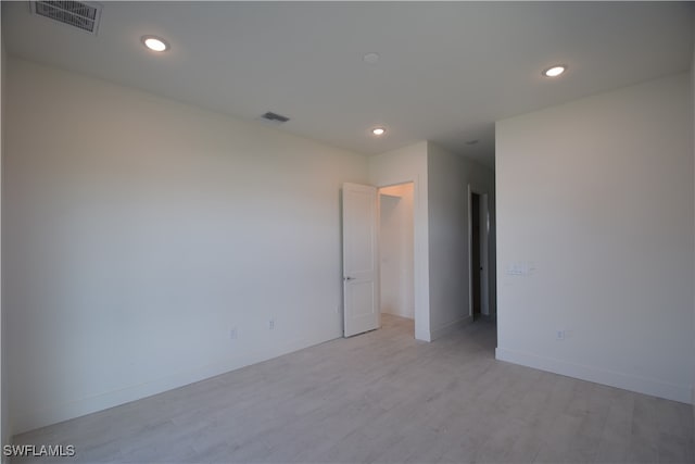 unfurnished room featuring light hardwood / wood-style flooring