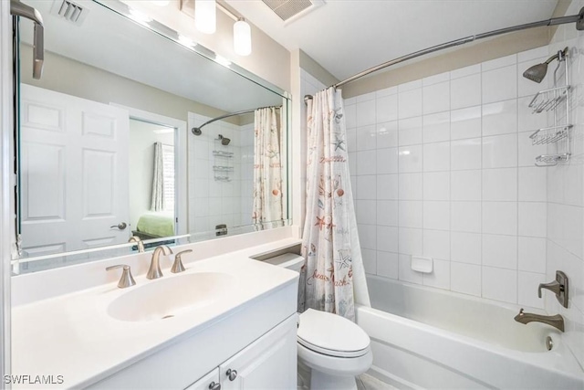 bathroom with vanity, shower / bath combination with curtain, toilet, and visible vents
