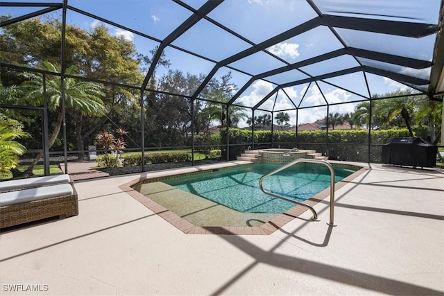 view of swimming pool featuring a pool with connected hot tub, a lanai, a patio area, and a grill