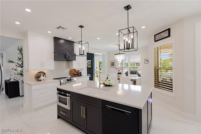 1045 Cottonwood Ct, Marco Island, FL 34145 - kitchen featuring a sink, a chandelier, appliances with stainless steel finishes, light countertops, and recessed lighting