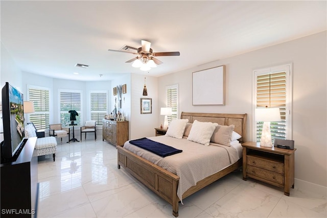 1045 Cottonwood Ct, Marco Island, FL 34145 - bedroom featuring light marble finish flooring, baseboards, and a ceiling fan