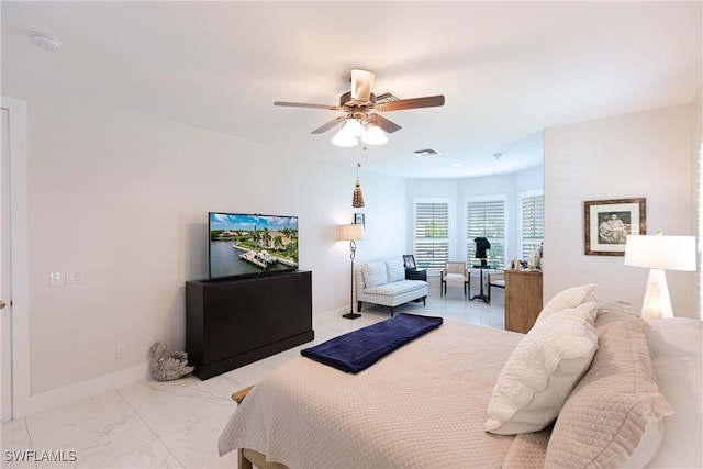1045 Cottonwood Ct, Marco Island, FL 34145 - bedroom featuring light marble finish flooring, baseboards, and ceiling fan