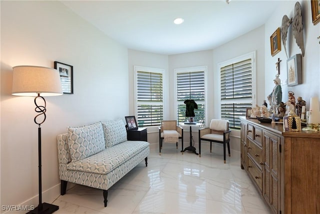 1045 Cottonwood Ct, Marco Island, FL 34145 - living area with light marble finish floors, baseboards, and recessed lighting