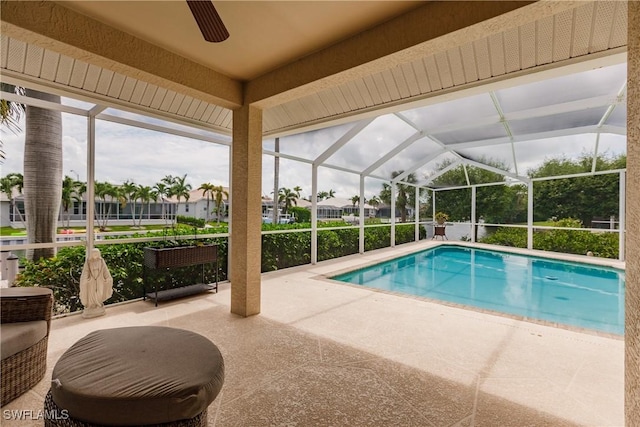 1045 Cottonwood Ct, Marco Island, FL 34145 - outdoor pool featuring a ceiling fan, a patio area, glass enclosure, and a residential view