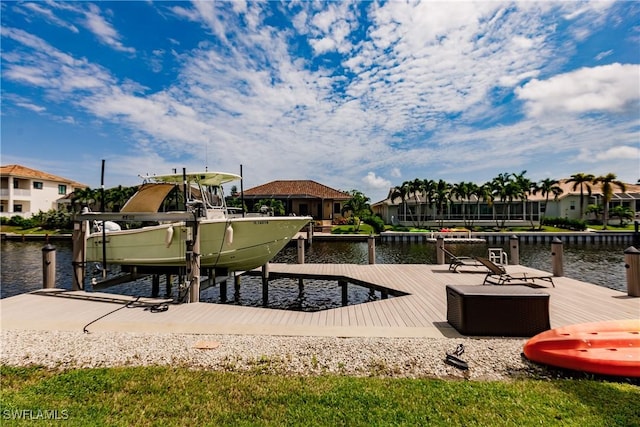 1045 Cottonwood Ct, Marco Island, FL 34145 - dock area featuring boat lift, a water view, and a residential view