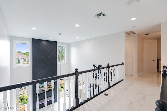 1045 Cottonwood Ct, Marco Island, FL 34145 - corridor with recessed lighting, marble finish flooring, and an upstairs landing