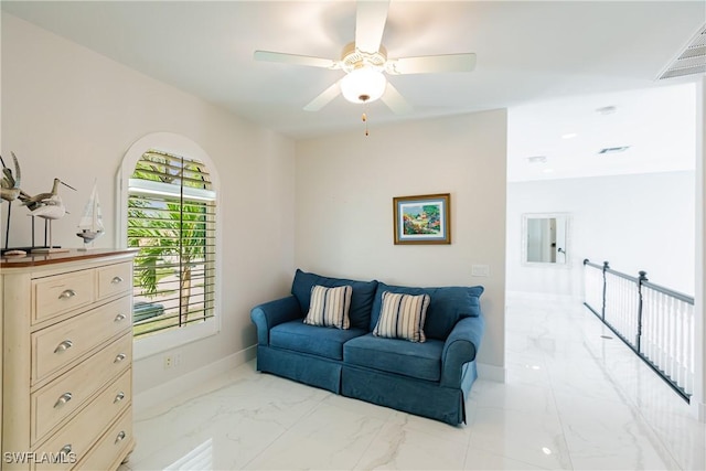 1045 Cottonwood Ct, Marco Island, FL 34145 - living room with light marble finish flooring, a ceiling fan, and baseboards