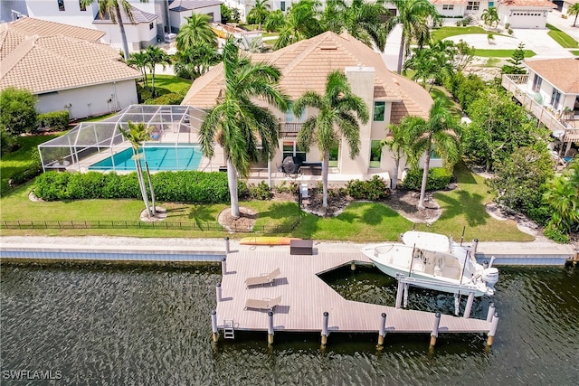 birds eye view of property with a water view