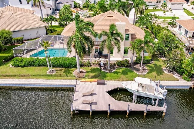 1045 Cottonwood Ct, Marco Island, FL 34145 - back of house with a water view, an outdoor pool, a tile roof, and a residential view