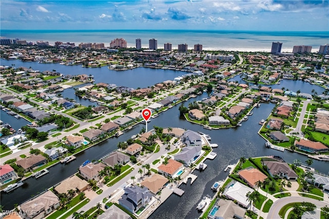 birds eye view of property featuring a water view