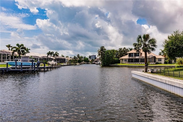1045 Cottonwood Ct, Marco Island, FL 34145 - water view with nearby suburban area and a boat dock