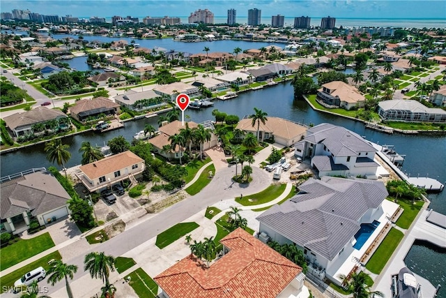 1045 Cottonwood Ct, Marco Island, FL 34145 - aerial view of residential area featuring a nearby body of water and city skyline