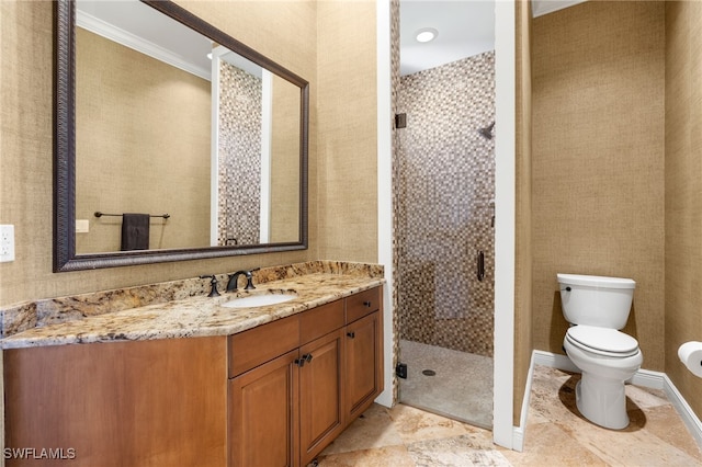 bathroom featuring toilet, vanity, crown molding, and a shower with door