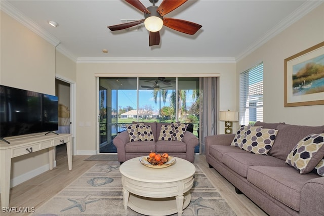 living room with crown molding, light wood-type flooring, and ceiling fan