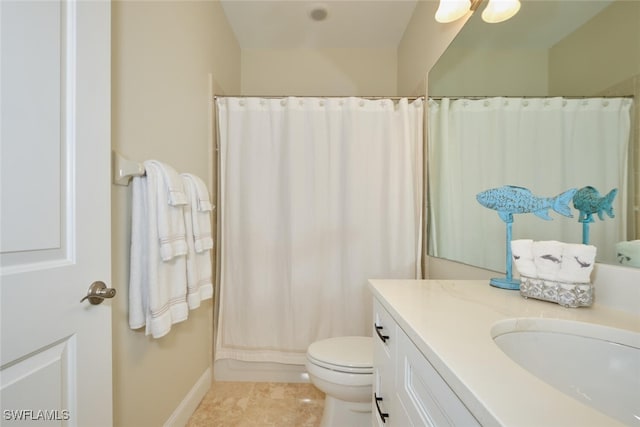 bathroom with vanity, toilet, walk in shower, and tile patterned flooring