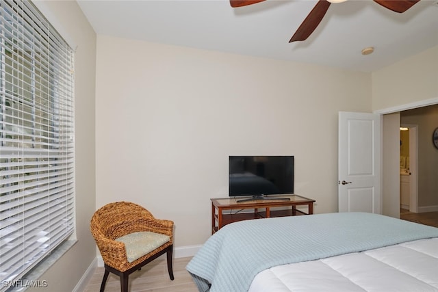 bedroom with hardwood / wood-style flooring and ceiling fan