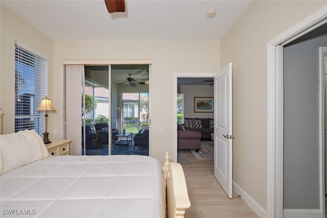 bedroom with a closet, access to exterior, light hardwood / wood-style floors, and ceiling fan