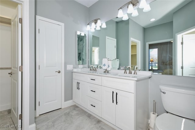 bathroom featuring vanity and toilet