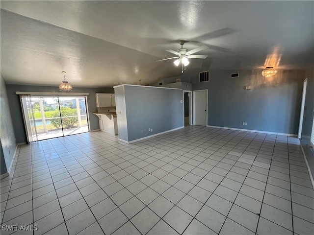 unfurnished living room featuring a textured ceiling, ceiling fan with notable chandelier, light tile patterned floors, and lofted ceiling