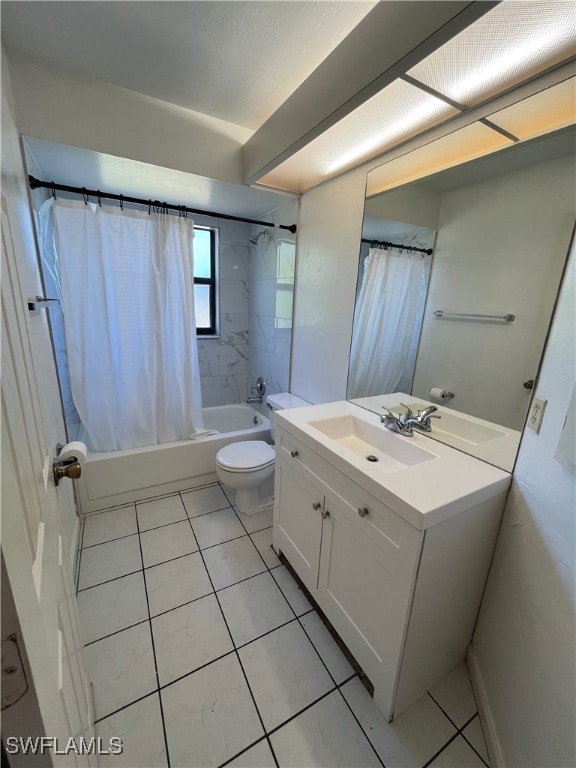 full bathroom featuring tile patterned floors, shower / bath combination with curtain, toilet, and vanity