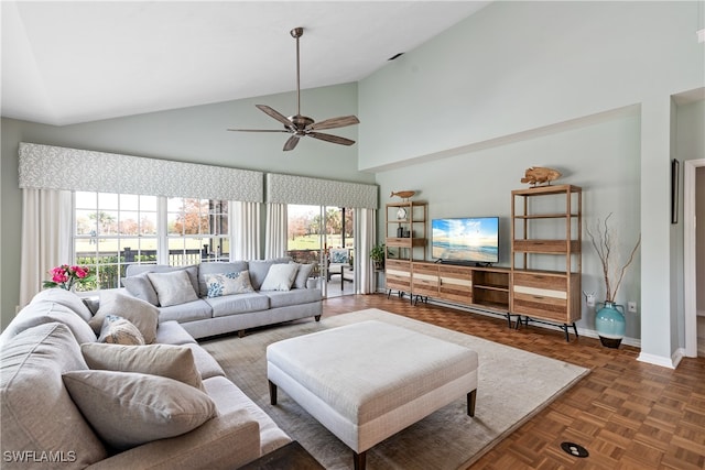 living room with ceiling fan, dark parquet flooring, and high vaulted ceiling