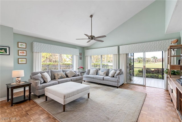 living room with high vaulted ceiling, light parquet floors, and ceiling fan