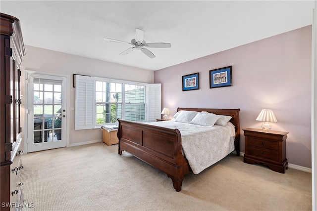 bedroom with ceiling fan and light carpet