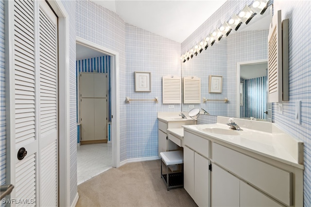 bathroom with vanity and vaulted ceiling