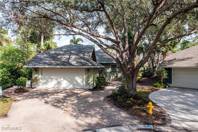 ranch-style home featuring a garage