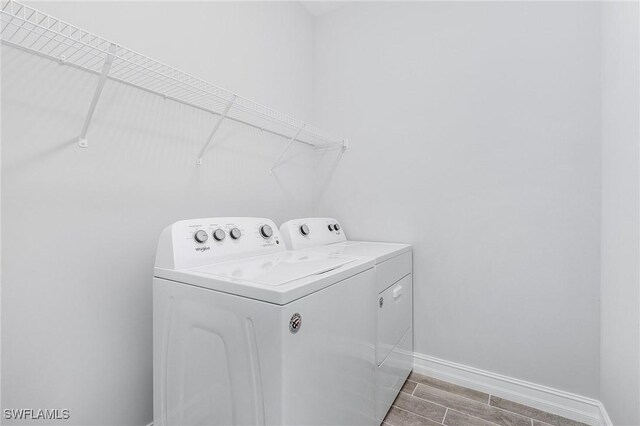 laundry area with separate washer and dryer