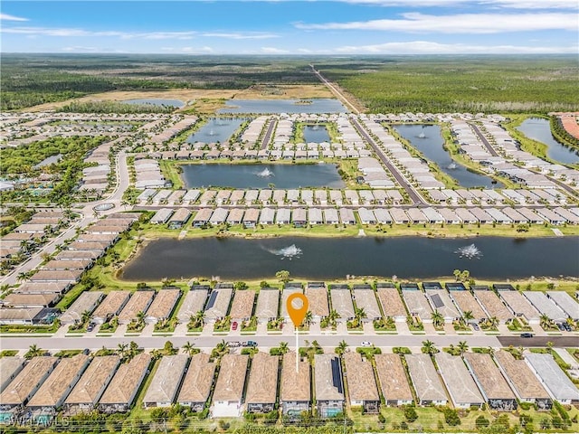 drone / aerial view featuring a water view and a residential view