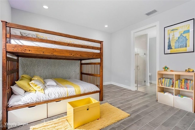 bedroom with baseboards, wood finished floors, visible vents, and recessed lighting