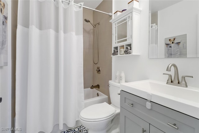 full bathroom with vanity, shower / bath combo with shower curtain, and toilet