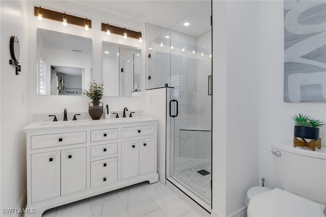 bathroom with vanity, toilet, and an enclosed shower