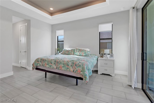 bedroom with a tray ceiling