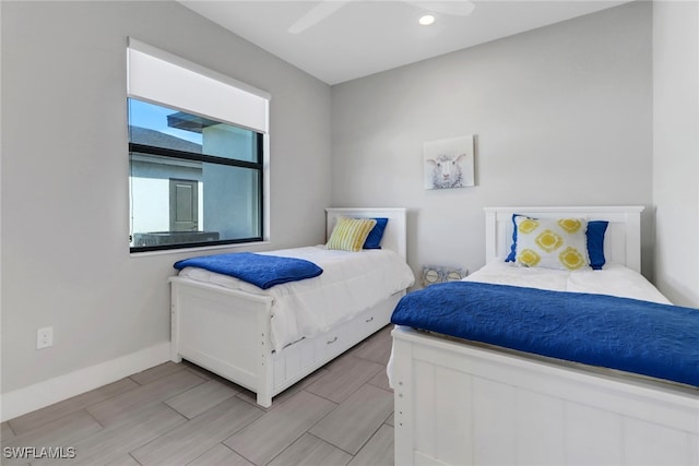 bedroom featuring ceiling fan and light hardwood / wood-style floors