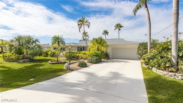 ranch-style house with a garage and a front lawn