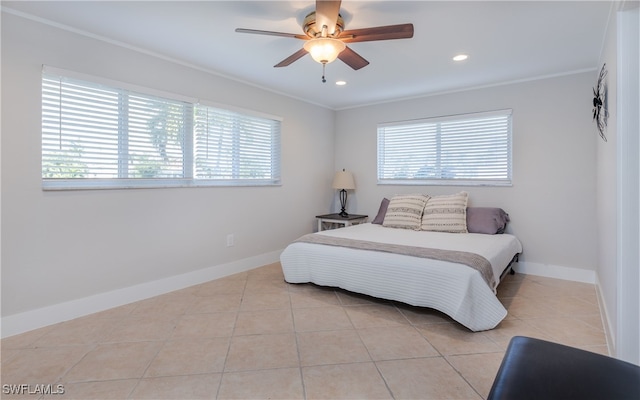 tiled bedroom featuring ceiling fan, crown molding, and multiple windows