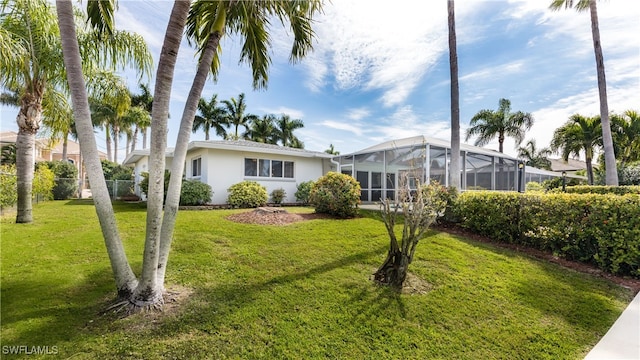 view of yard with a lanai