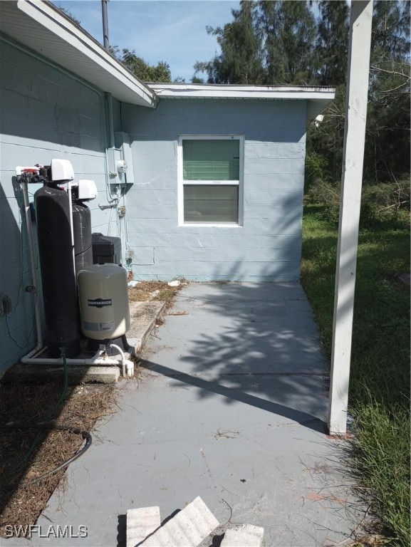 view of side of home with a patio area