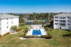 view of pool featuring a yard