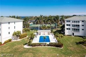 1250 W Marion Ave Unit 242, Punta Gorda, FL 33950 - view of swimming pool featuring a yard