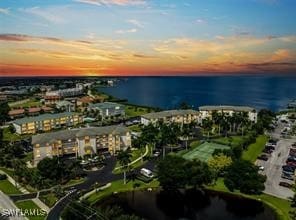 aerial view at dusk with a water view