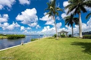 exterior space featuring a water view and a gazebo