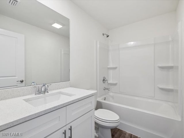 full bathroom with vanity, toilet, shower / bathing tub combination, and hardwood / wood-style floors