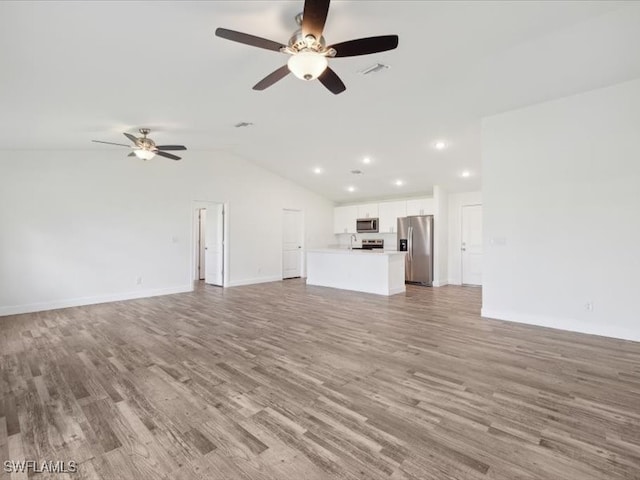 unfurnished living room featuring light hardwood / wood-style flooring, lofted ceiling, and ceiling fan