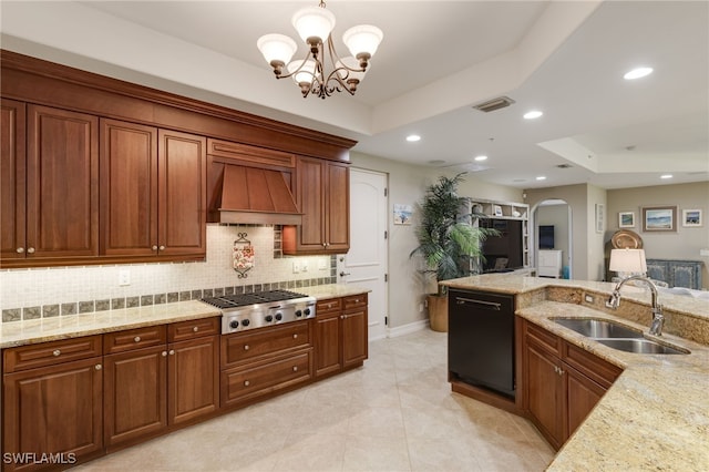 kitchen featuring black dishwasher, sink, a tray ceiling, stainless steel gas stovetop, and custom range hood